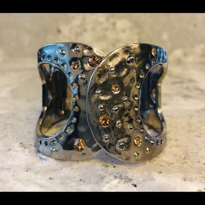 Bracelet with gold color stones.